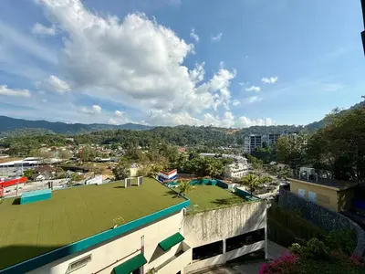 a view of a city with a green roof at 1BR Panoramic Mountain View Walk to Beach by Renttini in Kamala Beach
