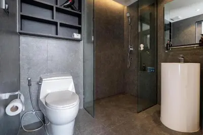 a bathroom with a toilet and a shower at Relax at CTG L702-3 - Kamala Health Complex in Kamala Beach
