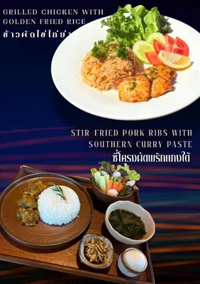 a plate of food with rice and vegetables on a table at Sireha Cafe Resort and Glamping in Ban Khok Chang