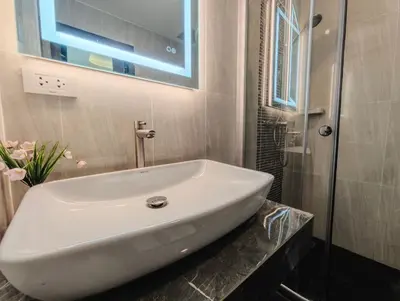 a white sink on a counter in a bathroom at JJame Pool Villa Patong in Patong Beach