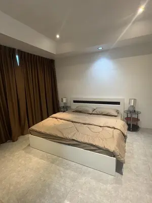 a bedroom with a large bed in a room at Kamala Cozy Townhouse in Kamala Beach