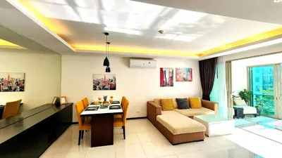 a living room with a couch and a table at Phuket KAMALA Apartment in Phuket Town