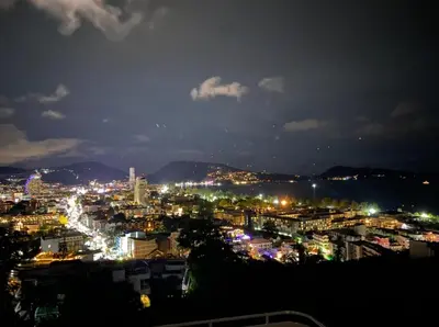a view of a city at night at Andaman Hills pool Seaview house in Patong Beach