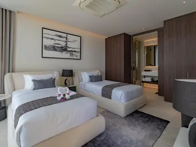 a hotel room with two beds and a couch at NEW Luxury Seaview 3BR Villa in Layan - Villa Luma in Layan Beach