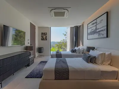 a bedroom with two beds and a large window at NEW Luxury Seaview 3BR Villa in Layan - Villa Luma in Layan Beach