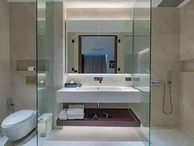 a bathroom with a sink and a toilet and a mirror at NEW Luxury Seaview 3BR Villa in Layan - Villa Luma in Layan Beach