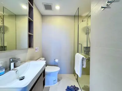 a bathroom with a toilet and a sink and a shower at Laguna Skypark 2 Bedroom scenic view in Laguna Phuket