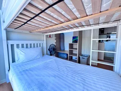 a bedroom with a bed with a wooden ceiling at Laguna Skypark 2 Bedroom scenic view in Laguna Phuket