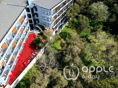 an overhead view of a building with cars parked in a yard at Apple A Day Resort Krabi, Ao Nang Beach in Ao Nang Beach