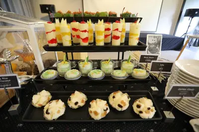a display of desserts and pastries on a table at Apple A Day Resort Krabi, Ao Nang Beach in Ao Nang Beach
