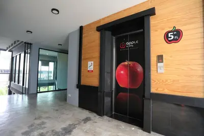 a large apple on the wall of a building at Apple A Day Resort Krabi, Ao Nang Beach in Ao Nang Beach