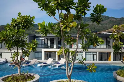 an image of a hotel with trees in the foreground at Great Apartment Sea Heaven 2 min to Nai Thon Beach in Nai Thon Beach