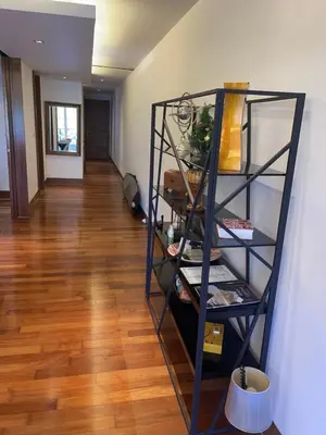 a shelf in a room with a wooden floor at Beachfront 2BR Apartment with Pool View in Nai Thon Beach