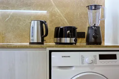 two coffeemakers sitting on top of a counter at The Ozone Bangtao by Beringela in Laguna Phuket