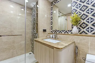 a bathroom with a sink and a shower at The Ozone Bangtao by Beringela in Laguna Phuket