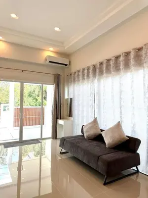 a bedroom with a bed and a large window at Cozy Thai-Style House with Private Pool, Bang Tao in Ban Pak Lak