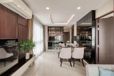 a kitchen and dining room with a table and chairs at Ocean Horizon Residences - 2-BR, BangTao Beach in Ban Lum Fuang