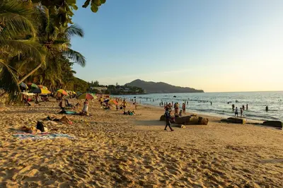 a group of people on a beach with the ocean at Ocean Horizon Residences - 2-BR, BangTao Beach in Ban Lum Fuang