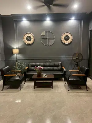 a living room with a couch and two chairs at The Sense 2 in Patong Beach