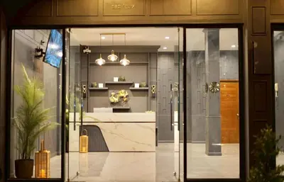 a glass door of a building with a counter at The Sense 2 in Patong Beach