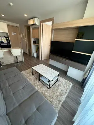 a living room with a large flat screen tv at 2 комнатные апартаменты с одной спальней и кухней-гостиной in Phuket Town