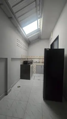 a large white room with a skylight and a kitchen at Phuket villa airport in Nai Yang Beach