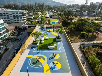 an overhead view of a building with a park on the roof at Laguna Beach Residences Seashore by Banyan Living in Phuket