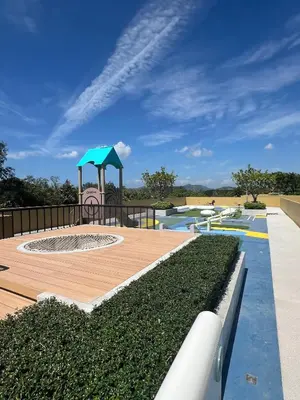 a pool with a playground with a water park at Laguna Beach Residences Seashore by Banyan Living in Phuket