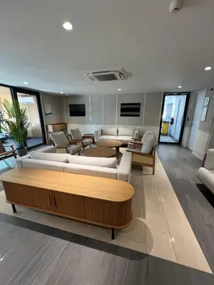 a large living room with couches and a table at Laguna Beach Residences Seashore by Banyan Living in Phuket