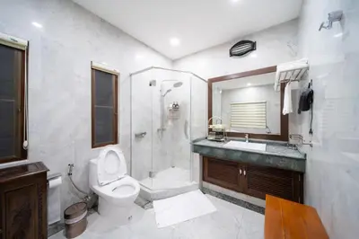 a bathroom with a toilet and a shower and a sink at D Villa Phuket-Luxury 6-Bedroom Private Villa in Panwa Entire Place in Phuket Town