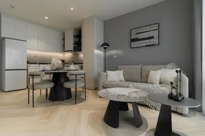 a living room with a couch and a table at Title Legendary Apartment 800m to Bang Tao Beach in Bang Tao Beach