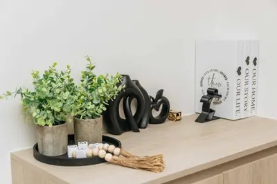 a shelf with two vases and plants on it at C262 Relax 2BR Condo with Pool and Full Gym in Kathu