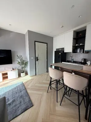 a kitchen with a table and chairs in a room at Legendary F705 - Top floor family 1BR - The Title Legendary by UNO in Bang Tao Beach