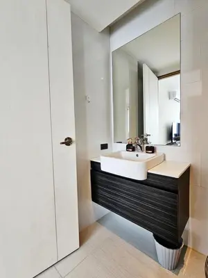 a bathroom with a sink and a mirror at patong see view condo in Patong Beach