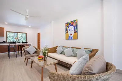 a living room with a couch and a table at Large Private Pool 5BR Villa Tony near Promthep Cape in Nai Harn Beach
