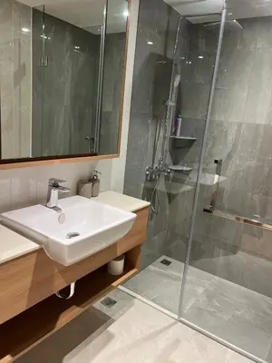 a bathroom with a sink and a shower at 3 bedrooms in Laguna, Bangtao Beach 5 min walk in Bang Tao Beach