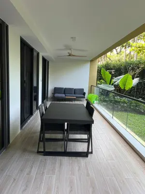 a dining room with a table and chairs on a balcony at 3 bedrooms in Laguna, Bangtao Beach 5 min walk in Bang Tao Beach