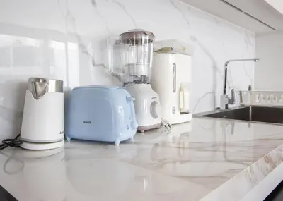 a kitchen with several appliances on a counter at Kora 267 3BR Condo with Pool View in Phuket Town