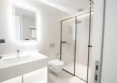 a bathroom with a toilet and a sink and a shower at Kora 267 3BR Condo with Pool View in Phuket Town