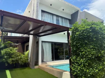 an external view of a house with a swimming pool at Villa DIAZ RAWAI in Ban Saiyuan (1)