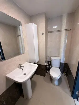 a bathroom with a white toilet and a sink at The Signature Studio at Mai Khao by FAMILY HOMES CB-846 in Ban Mai Salae