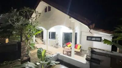 a view of a living room in a house at Watermelon House at Nong Thale Garden & Kitchen in Ban Khao Klom