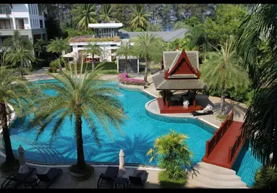 an overhead view of a swimming pool with palm trees at Naithon Beach Pearl of Naithon in Nai Thon Beach