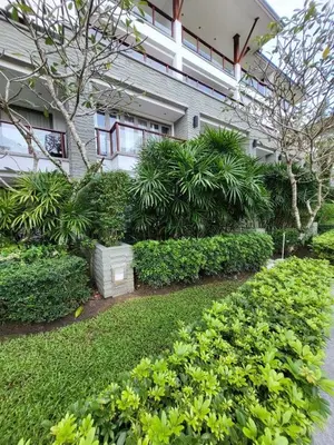 a building with a bunch of plants in front of it at Naithon Beach Pearl of Naithon in Nai Thon Beach