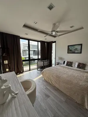 a bedroom with a bed and a ceiling fan at Laguna villa with private pool in Ban Phru Champa