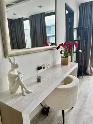 a desk with a rabbit sitting on it in a room at Laguna villa with private pool in Ban Phru Champa