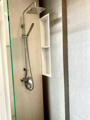 a shower in a bathroom with a glass door at Laguna villa with private pool in Ban Phru Champa