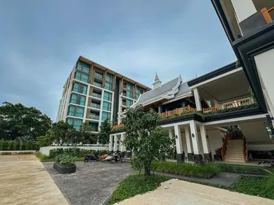 a large building next to a parking lot in front at The Ozone Residences Bangtao Beach 1Bdr in Laguna Phuket