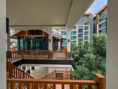 an external view of a house with a balcony at The Ozone Residences Bangtao Beach 1Bdr in Laguna Phuket