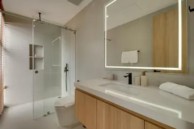 a bathroom with a sink and a shower and a toilet at New 4 bedroom villa 700 meters to Bang Tao Beach in Ban Thalat Choeng Thale